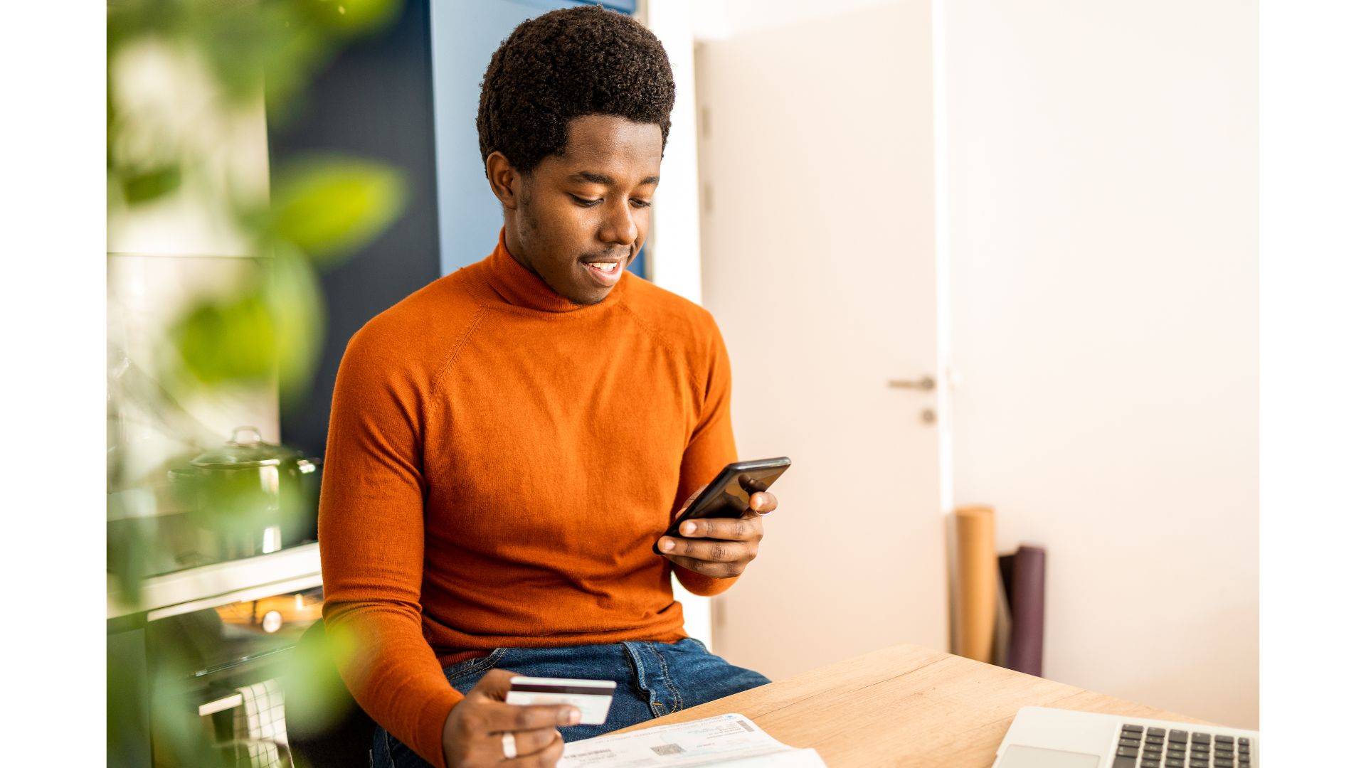 Black man setting up his mobile banking app
