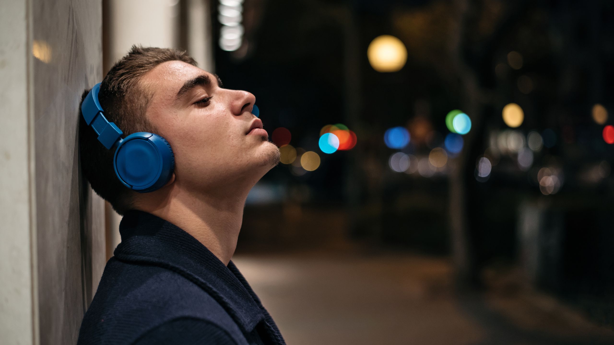 Young man with Bluetooth headphones