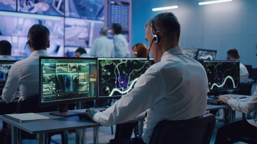 Room of agents in a surveillance center tracing text messages