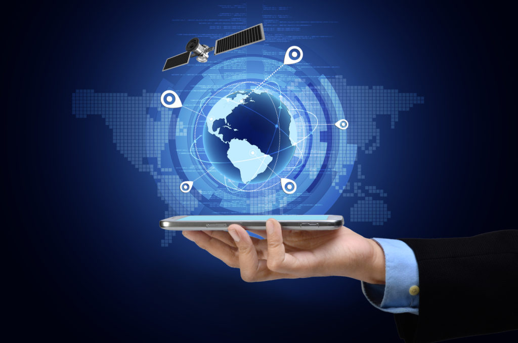Hand holding a phone with an image of the Earth with a satellite and location dots circling.
