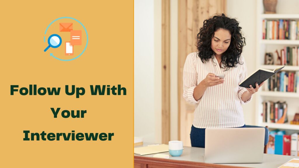 A woman at home , a phone on hand an a diary on the other, she is calling up with her interviewer