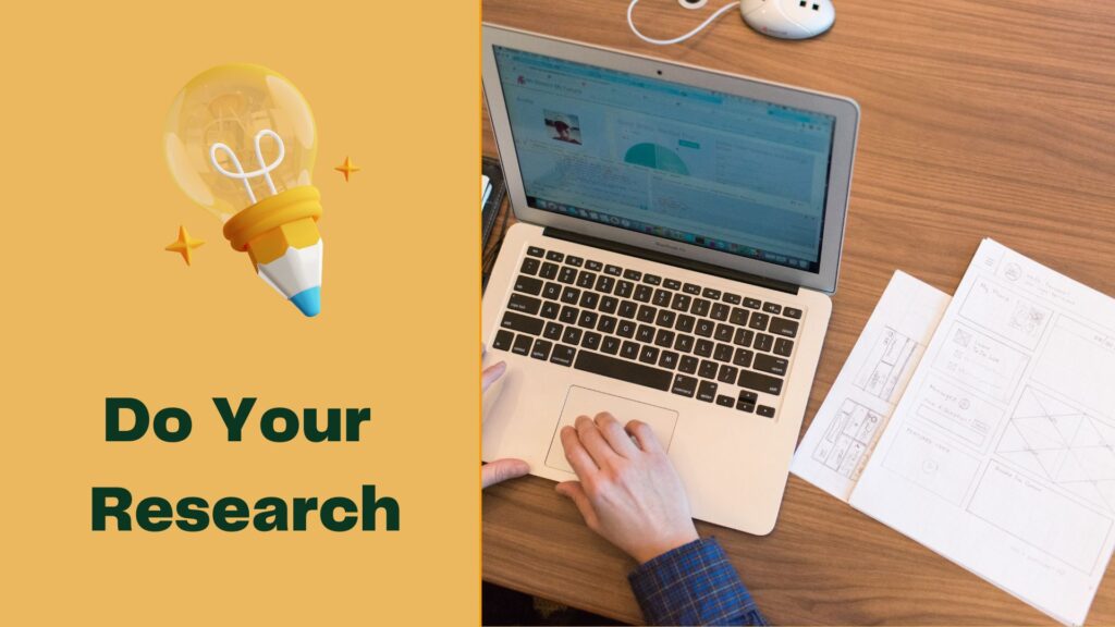 a man with laptop and papers on desk researching about the company and job role before the interview