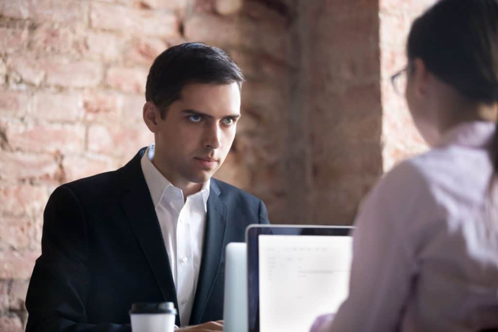 Man glaring at woman wanting to see her Google Drive files