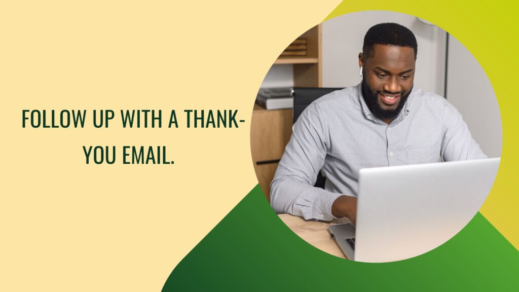 A man with a laptop writing a follow-up email to his interviewer