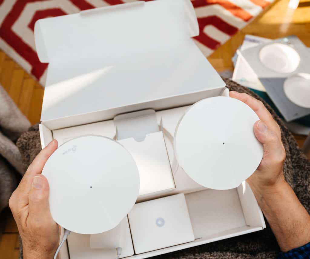 Unboxing a mesh Wi-Fi system for stronger connection so mobile data can be on or off