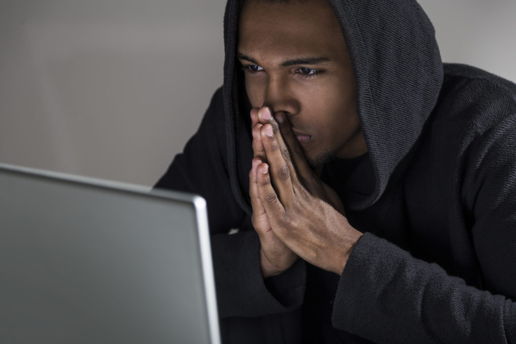 Smart man selecting the most secure computer software