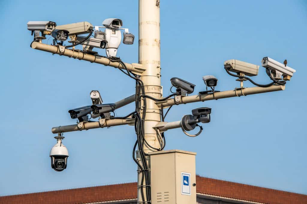 14 cctv cameras crowded on post in bejing illustrating importance of online privacy