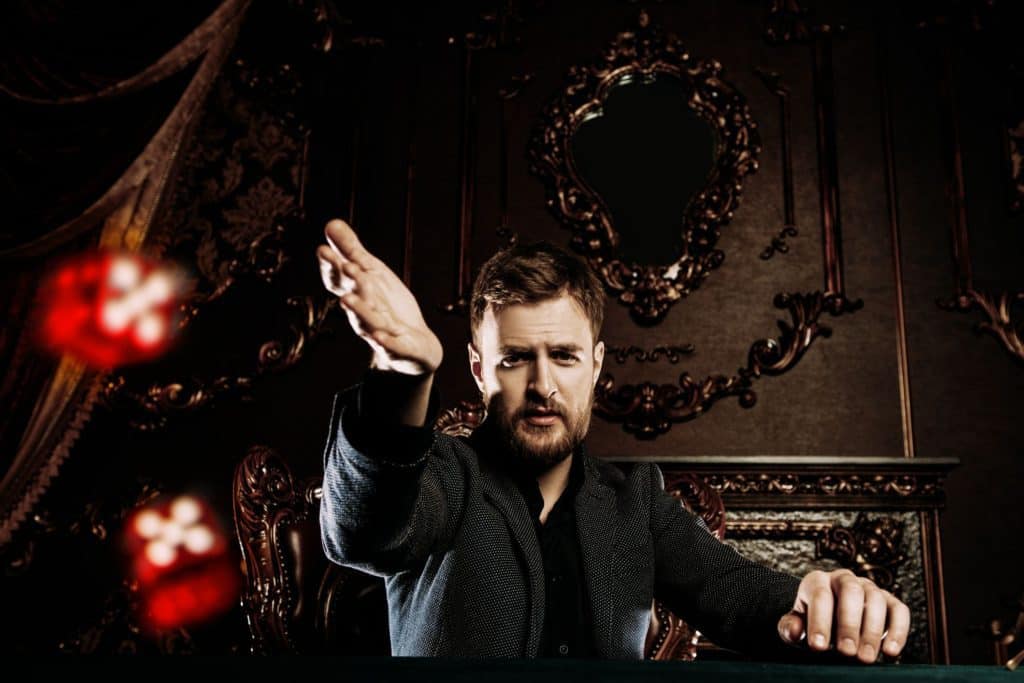 Man throwing dice for random password generating