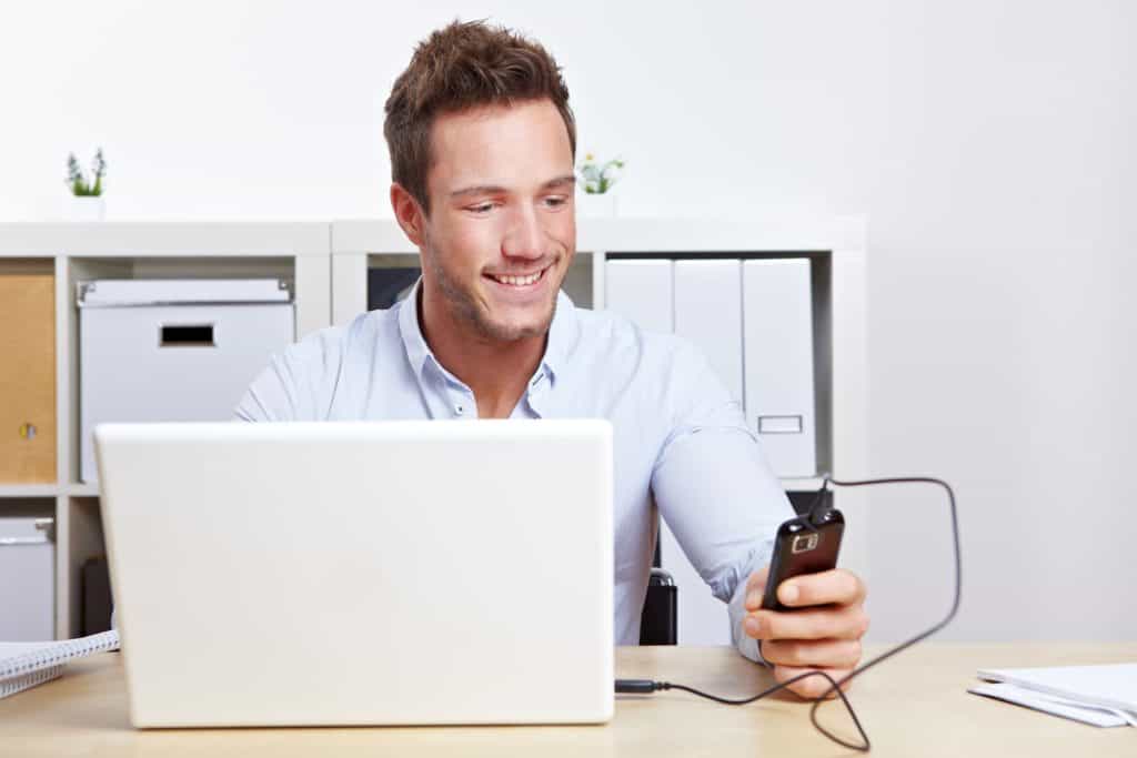 Man connected hist phone to laptop to side load apps potentially getting a virus