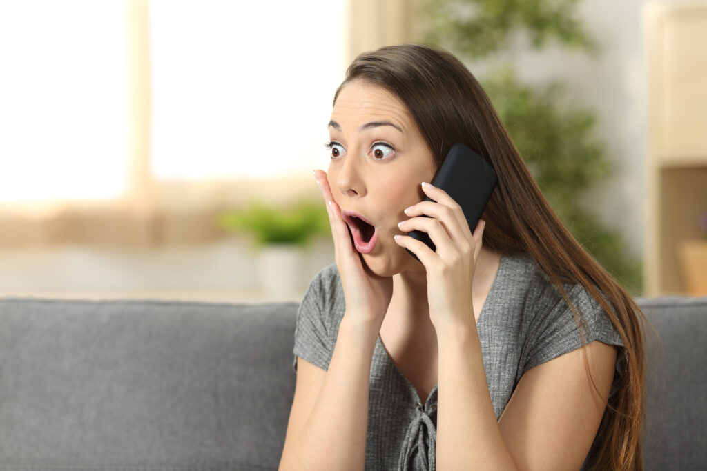 amazed woman on a WhatsApp phone call